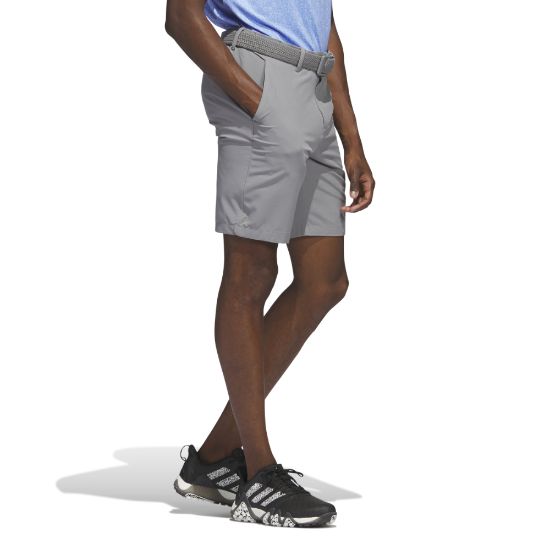 Model wearing adidas Men's Ultimate 365 Grey Three Golf Shorts Side View