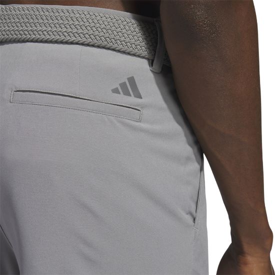 Model wearing adidas Men's Ultimate 365 Grey Three Golf Shorts Back View