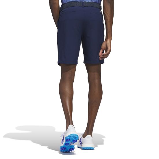 Model wearing adidas Men's Ultimate 365 Navy Golf Shorts Back View