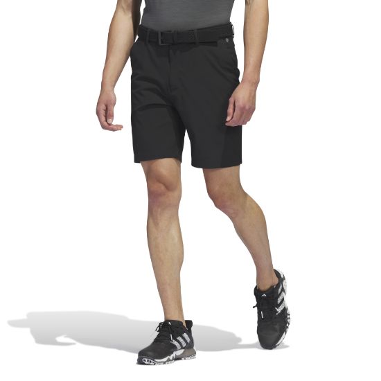 Model wearing adidas Men's Ultimate 365 Black Golf Shorts