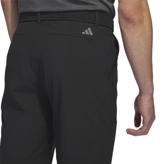 Model wearing adidas Men's Ultimate 365 Black Golf Shorts Back View