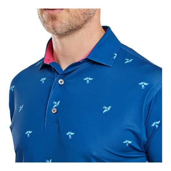Model wearing FootJoy Men's Thistle Print Lisle Deep Blue Golf Polo Shirt Front