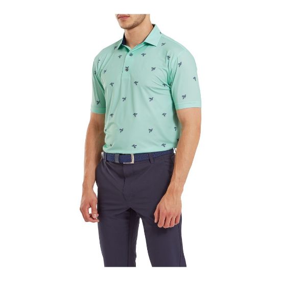 Model wearing FootJoy Men's Thistle Print Lisle Sea Glass Golf Polo Shirt