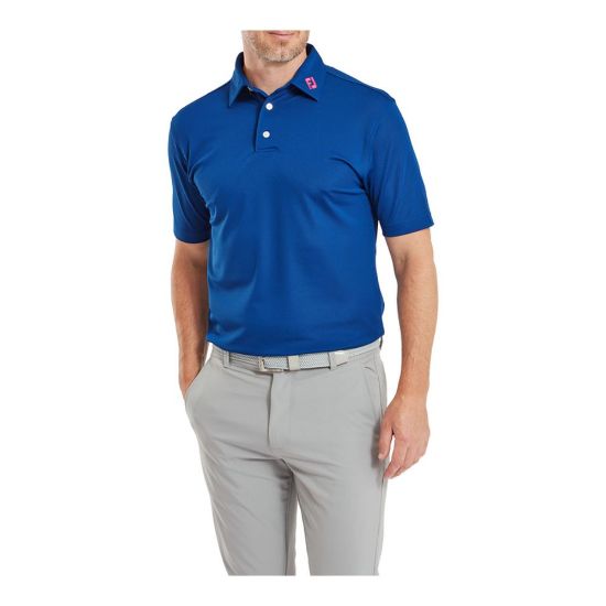 Model wearing FootJoy Men's Stretch Pique Solid Deep Blue Golf Polo Shirt