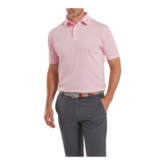 Model wearing FootJoy Men's Stretch Pique Solid Light Pink Golf Polo Shirt
