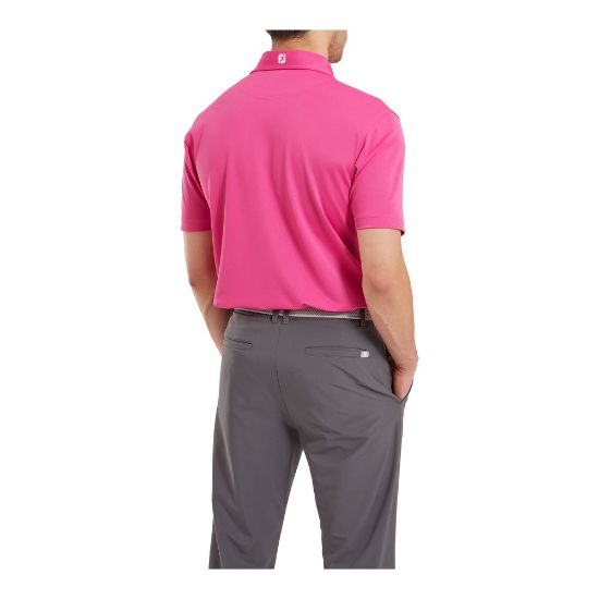 Model wearing FootJoy Men's Stretch Pique Solid Hot Pink Golf Polo Shirt Back View