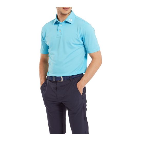 Model wearing FootJoy Men's Stretch Pique Solid Riviera Blue Golf Polo Shirt