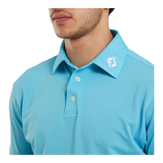 Model wearing FootJoy Men's Stretch Pique Solid Riviera Blue Golf Polo Shirt Front