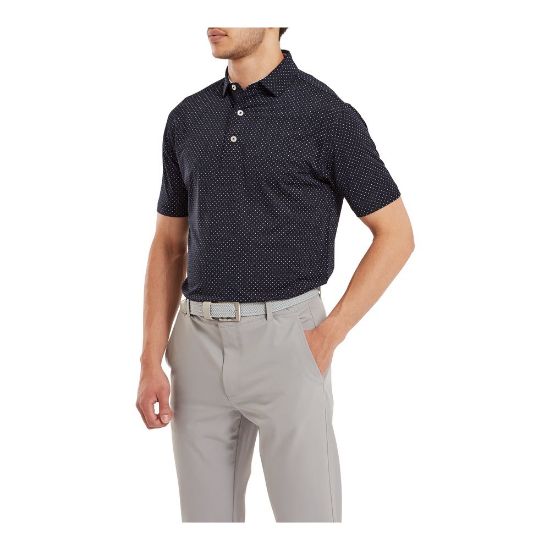 Model wearing FootJoy Men's Stretch Lisle Dot Print Navy/White Golf Polo Shirt