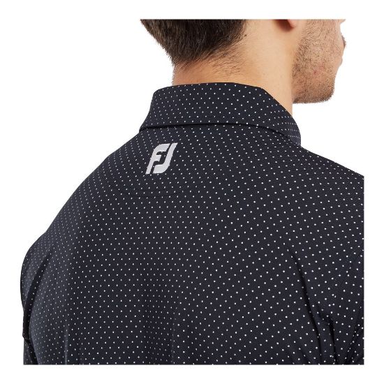 Model wearing FootJoy Men's Stretch Lisle Dot Print Navy/White Golf Polo Shirt Side View