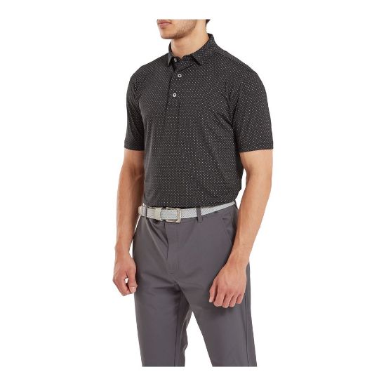 Model wearing FootJoy Men's Stretch Lisle Dot Print Black/Grey Golf Polo Shirt