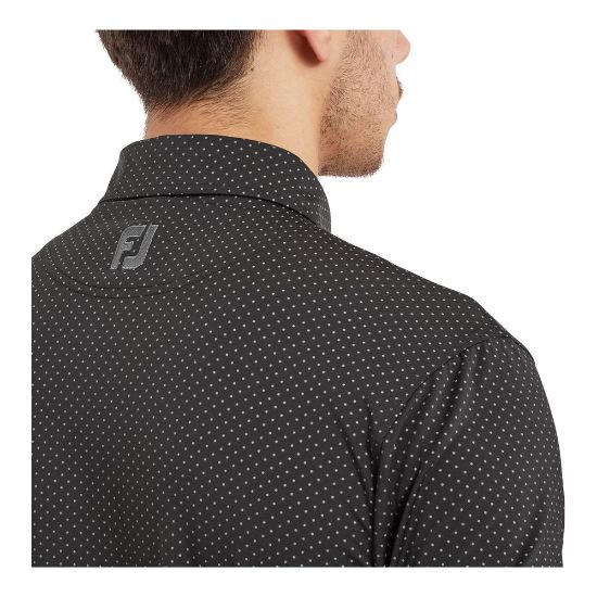 Model wearing FootJoy Men's Stretch Lisle Dot Print Black/Grey Golf Polo Shirt Side View