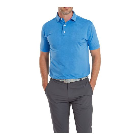 Model wearing FootJoy Men's Stretch Lisle Dot Print Ocean/Berry Golf Polo Shirt