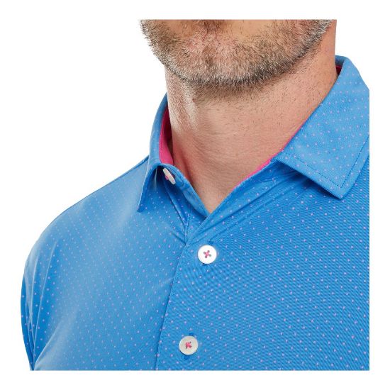 Model wearing FootJoy Men's Stretch Lisle Dot Print Ocean/Berry Golf Polo Shirt Side View