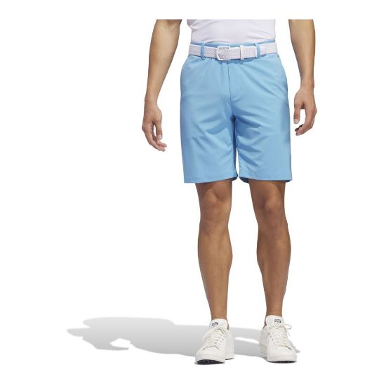 Model wearing adidas Men's Ultimate 365 Semi Blue Burst Golf Shorts