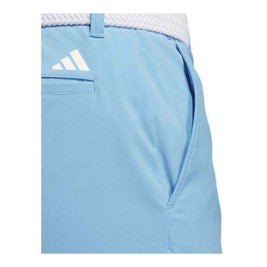 Model wearing adidas Men's Ultimate 365 Semi Blue Burst Golf Shorts Back View