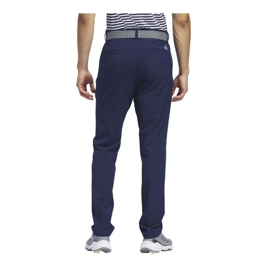 Model wearing adidas Men's Ultimate 365 Tapered Collegiate Navy Golf Pants Back View