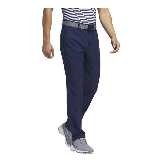 Model wearing adidas Men's Ultimate 365 Tapered Collegiate Navy Golf Pants Side View