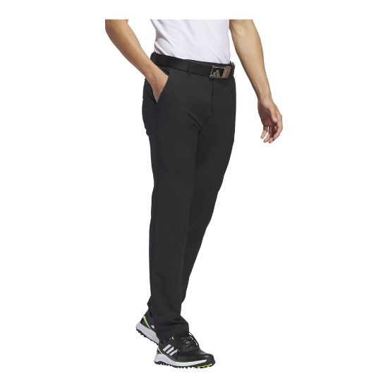 Model wearing adidas Men's Ultimate 365 Tapered Black Golf Pants Side View
