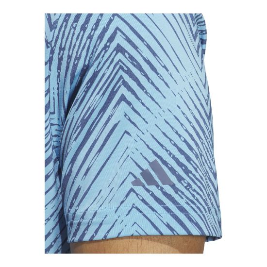 Model wearing adidas Men's Ultimate 365 Allover Print Blue Burst Golf Polo Shirt Sleeve View
