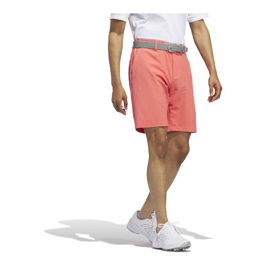 Model wearing adidas Men's Ultimate 365 Preloved Scarlet Golf Shorts Side View