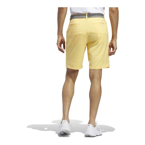 Model wearing adidas Men's Ultimate 365 Semi Spark Yellow Golf Short Back View