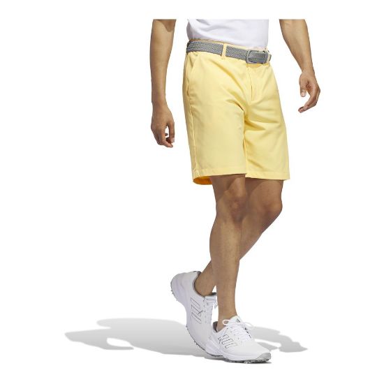 Model wearing adidas Men's Ultimate 365 Semi Spark Yellow Golf Short Side View