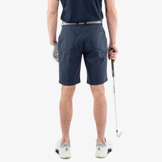 Model wearing Galvin Green Men's Percy V8+ Navy Golf Shorts Back View