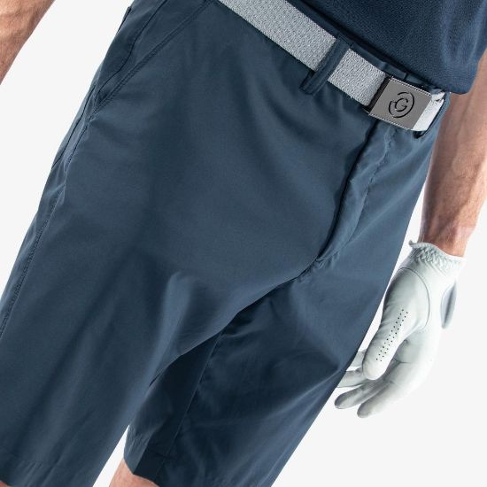Model wearing Galvin Green Men's Percy V8+ Navy Golf Shorts Side