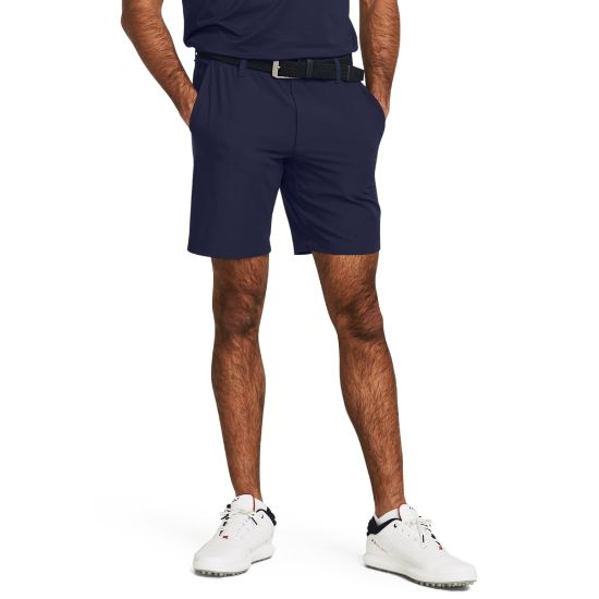 Model wearing Under Armour Men's Drive Taper Midnight Navy Golf Shorts