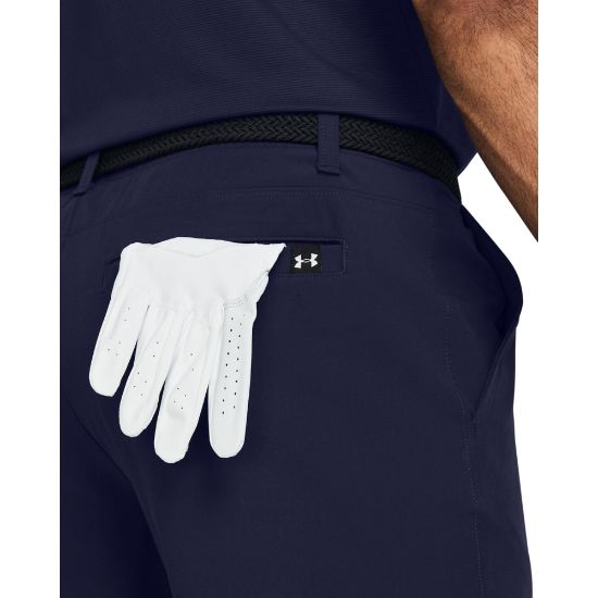 Model wearing Under Armour Men's Drive Taper Midnight Navy Golf Shorts Side