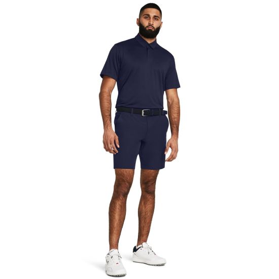 Model wearing Under Armour Men's Drive Taper Midnight Navy Golf Shorts Full View