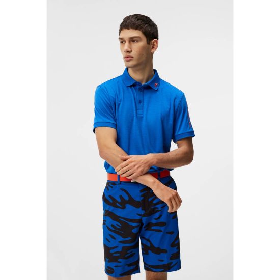 Model wearing J.Lindeberg Men's Tour Tech Nautical Blue Melange Golf Polo Shirt