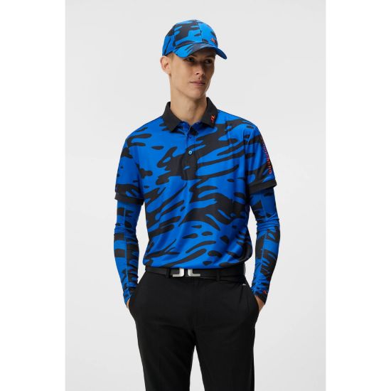 Model wearing J.Lindeberg Men's Tour Tech Print Neptune Blue Golf Polo Shirt