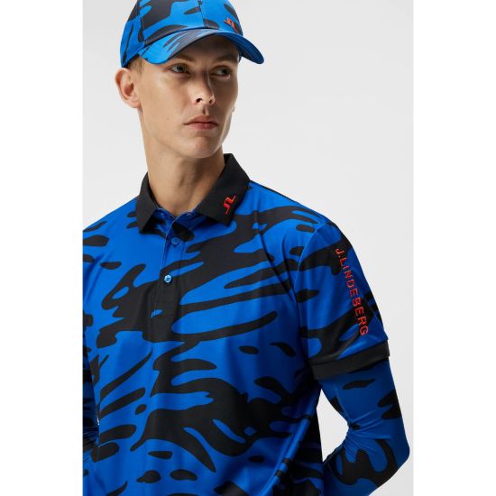 Model wearing J.Lindeberg Men's Tour Tech Print Neptune Blue Golf Polo Shirt Side