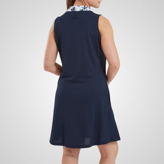 Model wearing FootJoy Ladies Floral Trim Navy Golf Dress Back View