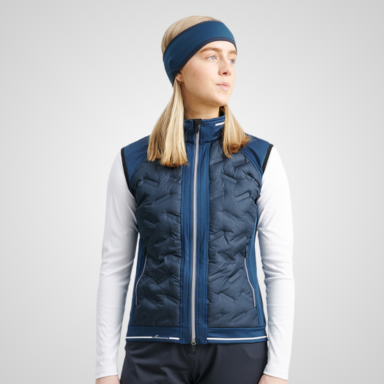 Model wearing Abacus Ladies Grove Hybrid Golf Vest Front View Peacock Blue