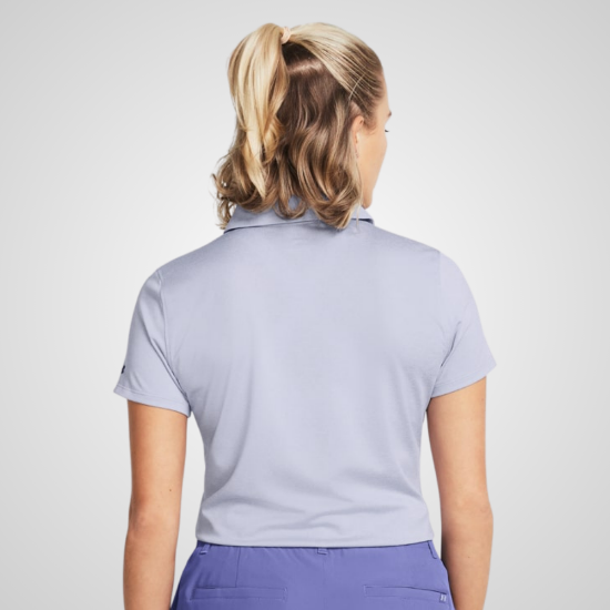 Model wearing Under Armour Ladies Playoff Celeste Golf Polo Shirt Back View