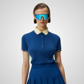 Model wearing J.Lindeberg Ladies Makena Estate Blue Golf Polo Shirt