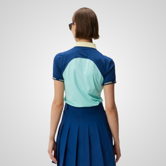 Model wearing J.Lindeberg Ladies Makena Blue Golf Polo Shirt Back View