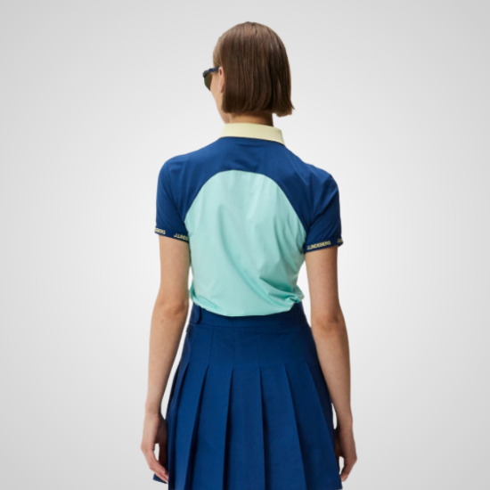 Model wearing J.Lindeberg Ladies Makena Estate Blue Golf Polo Shirt Back View