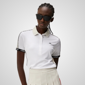 Model wearing J.Lindeberg Ladies Demi White Golf Polo Shirt