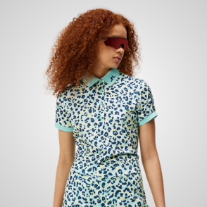 Model wearing J.Lindeberg Ladies Tour Tech Print Blue Golf Polo Shirt