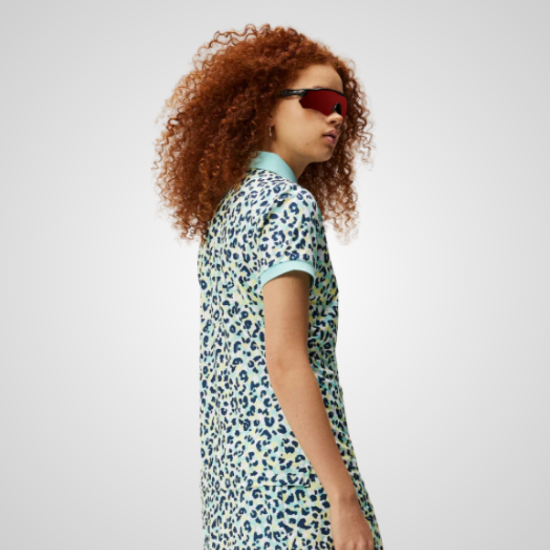 Model wearing J.Lindeberg Ladies Tour Tech Print Blue Golf Polo Shirt Side View