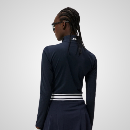 Model wearing J.Lindeberg Ladies Lauryn 1/2 Zip Navy Golf Midlayer Back View