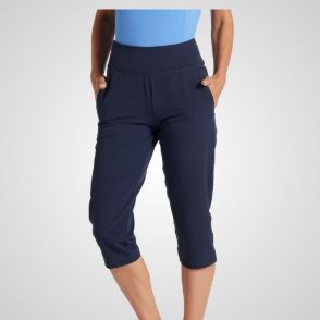 Model wearing Puma Ladies Everyday Capri Navy Golf Trousers Front View