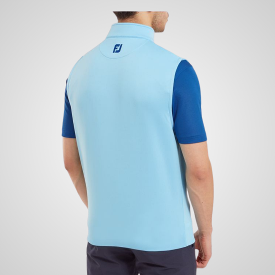 Model wearing FootJoy Men's 1/2 Zip Blue Sky Golf Vest Back View